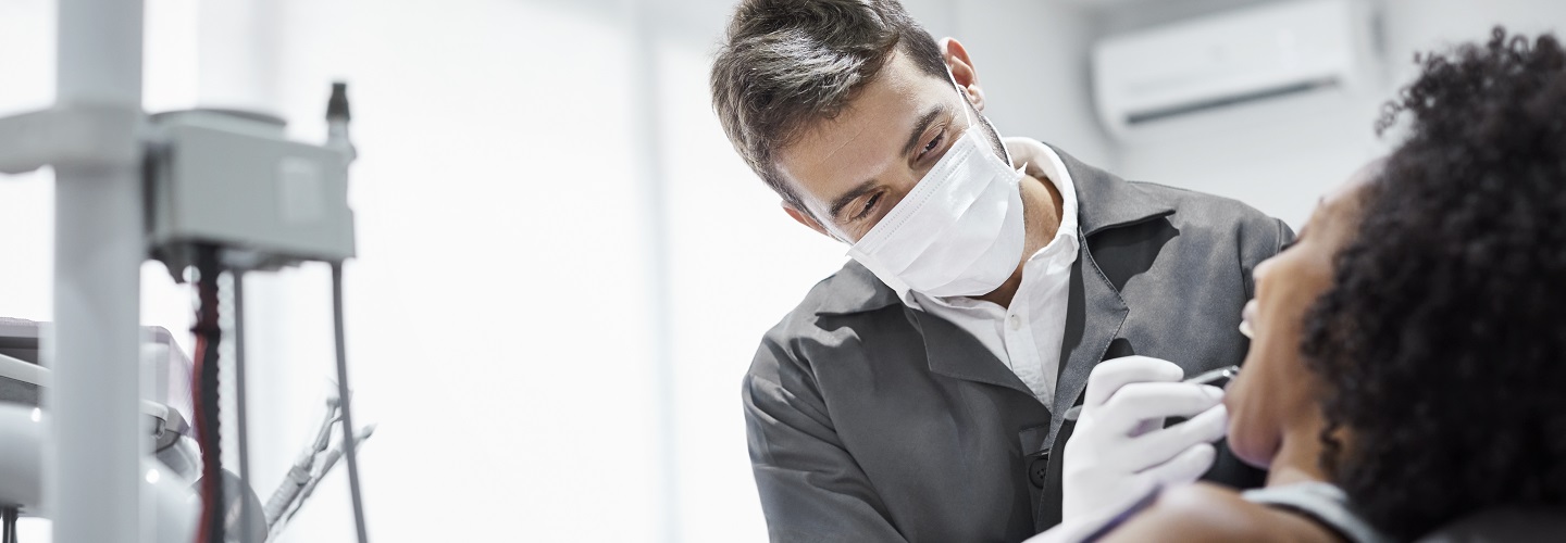 male dentist with patient