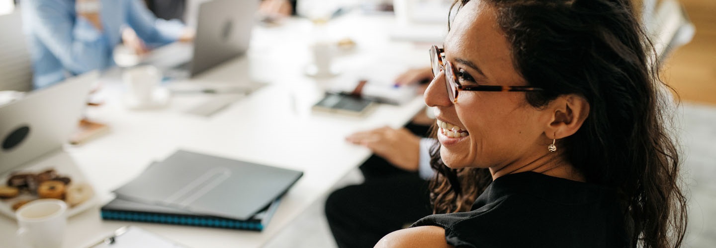 Woman smiling in a meeting