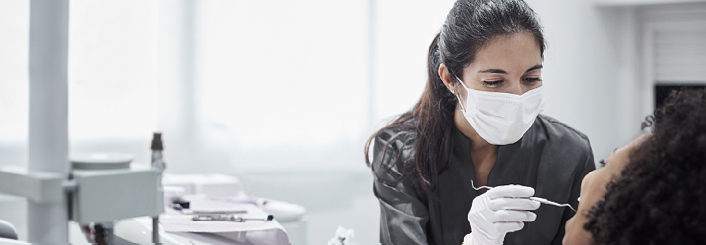 women dentist with patient